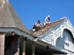 Men working on the Pritchard House roof.