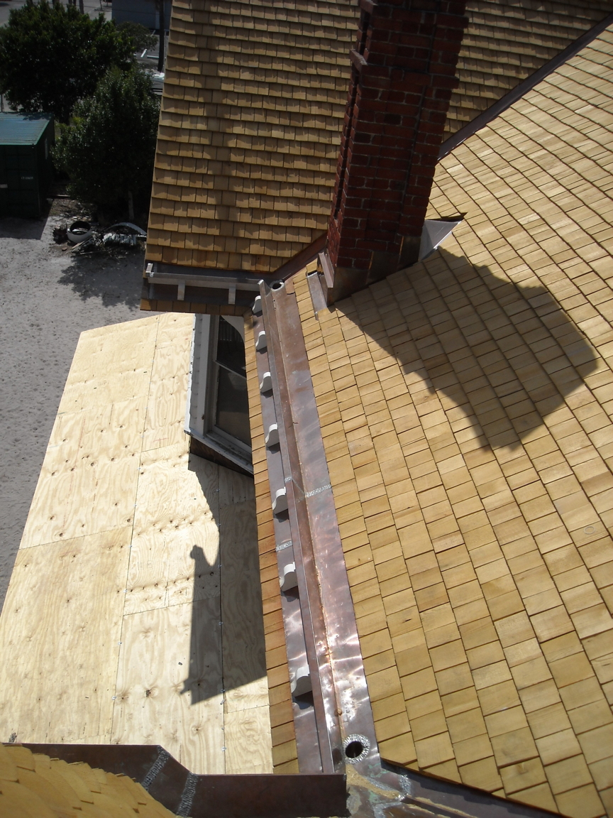 fishscale shingles being installed. fishscale shingles being installed.